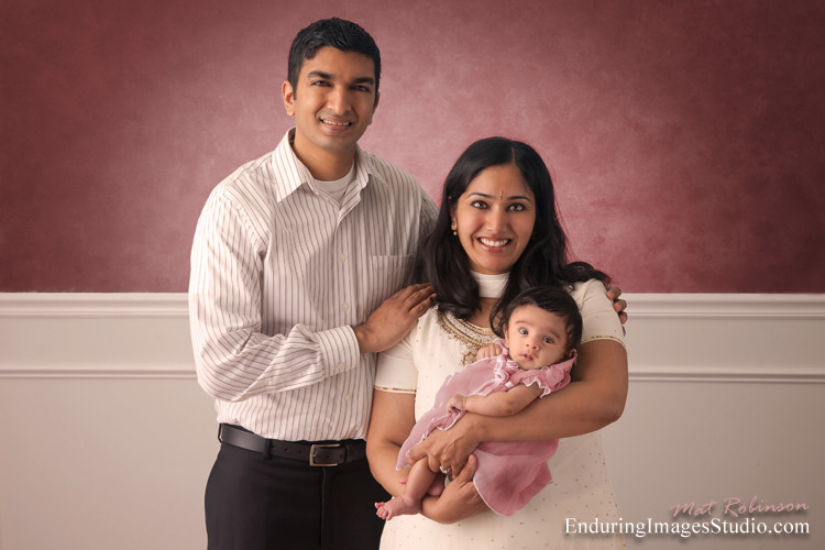 Proud parents have their portrait taken with their newborn - Denville