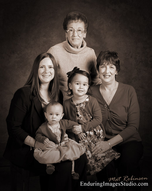 Four generations family portrait taken in Denville photography studio
